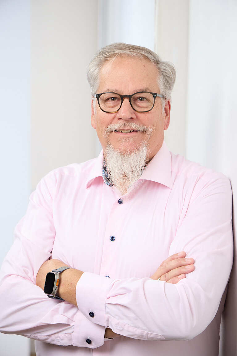 Ed Marsh, industrial sales advisor, in a pink dress shirt