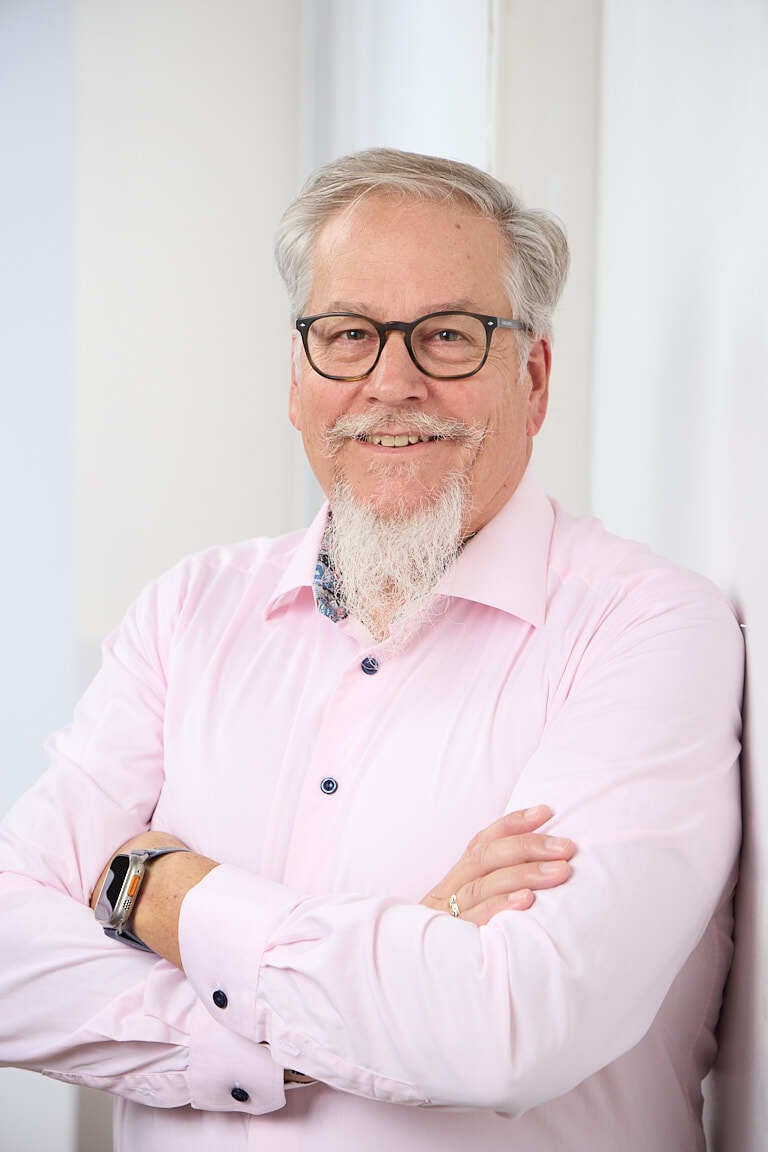 Ed Marsh, industrial sales growth consultant, in a pink dress shirt