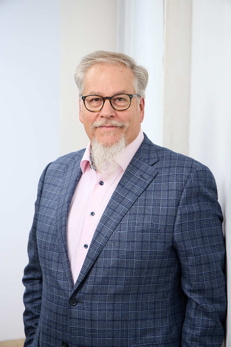 Ed Marsh, portfolio revenue growth consultant, in a navy blazer