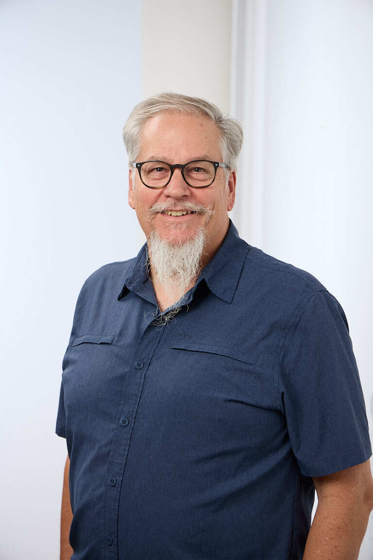 Ed Marsh, private equity revenue growth advisor, in an open-collar shirt