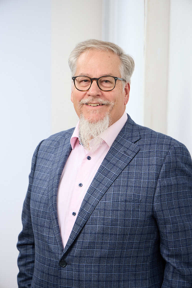 Ed Marsh, private equity value creation advisor, in a navy blazer