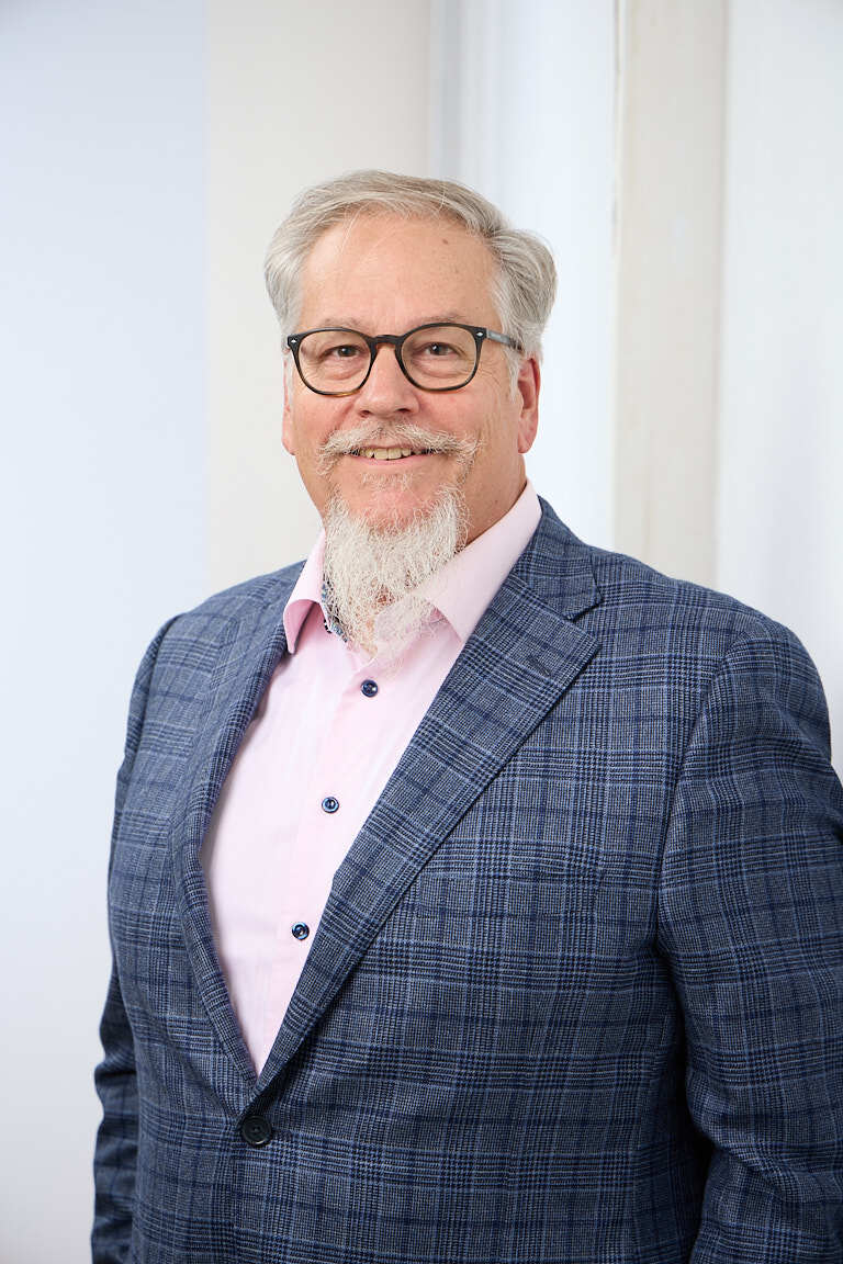 Ed Marsh, revenue growth consultant for industrial manufacturers, in a navy blazer